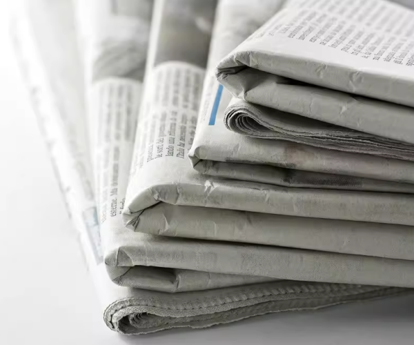 Newsprint_paper_made_into_newspapers.png